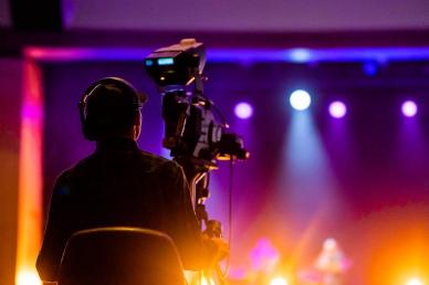Camera man managing live event video production of a concert