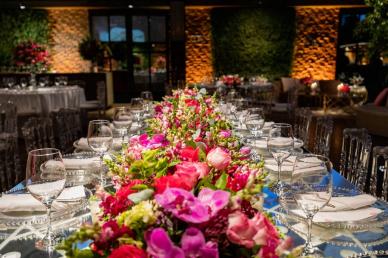 Wedding reception decor with floral arrangements on the dining table