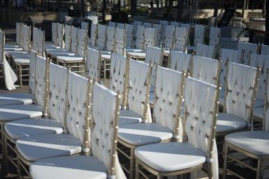 White chairs lined in rows outside