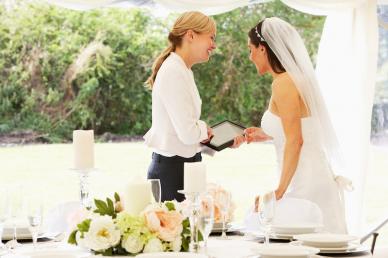 Wedding planner talking to bride