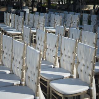 Chair rentals, white chairs embroidered, positioned in rows