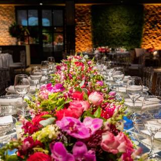 Floral arrangement as a centerpiece on a dining table at a wedding reception