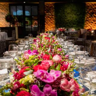 Wedding reception table with large flower centerpiece