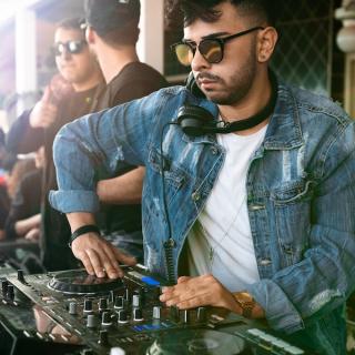 DJ working the sound board at a party