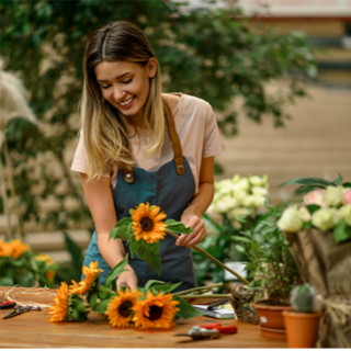 Woman sorting sunflowers in a flower shop