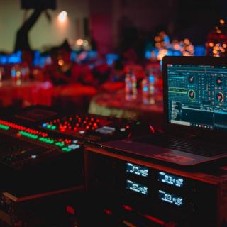Audiovisual equipment with sound board and red lighting