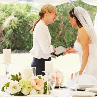 Wedding planner talking to bride